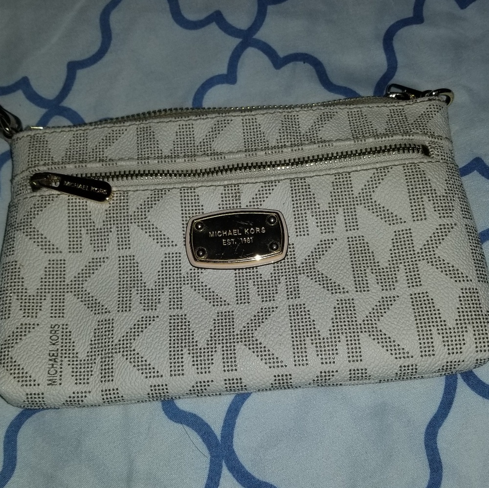 "MICHAEL KORS MONOGRAM LEATHER WRISTLET "